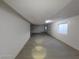 Spacious basement with gray flooring and large window at 1590 Mustang Dr, Henderson, NV 89002