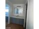 Clean bathroom with vanity, sink, and mirror at 1590 Mustang Dr, Henderson, NV 89002
