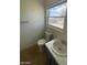 Simple bathroom with toilet, sink, and window at 1590 Mustang Dr, Henderson, NV 89002