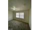 Well-lit bedroom with carpet flooring and two windows at 1590 Mustang Dr, Henderson, NV 89002