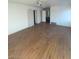Spacious bedroom with wood flooring and access to bathroom at 1590 Mustang Dr, Henderson, NV 89002