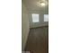 Bright bedroom with wood flooring and two windows at 1590 Mustang Dr, Henderson, NV 89002