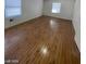 Spacious bedroom with hardwood floors and a window at 1590 Mustang Dr, Henderson, NV 89002
