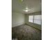 Bright bedroom with carpet and two windows at 1590 Mustang Dr, Henderson, NV 89002