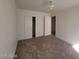 Bright bedroom featuring carpeted floors and ample closet space at 1590 Mustang Dr, Henderson, NV 89002