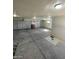 Spacious three-car garage with high ceilings at 1590 Mustang Dr, Henderson, NV 89002