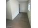 Clean and bright hallway with grey flooring at 1590 Mustang Dr, Henderson, NV 89002