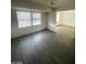Living room with hardwood floors and large windows at 1590 Mustang Dr, Henderson, NV 89002