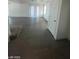 Open concept living area with hardwood floors and sliding glass doors at 1590 Mustang Dr, Henderson, NV 89002