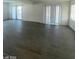 Large living room with wood flooring and sliding glass doors at 1590 Mustang Dr, Henderson, NV 89002