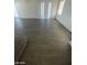 Living area featuring wood flooring and sliding glass doors at 1590 Mustang Dr, Henderson, NV 89002