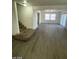 Spacious living room featuring hardwood floors and ample natural light at 1590 Mustang Dr, Henderson, NV 89002