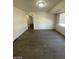 Open living room with wood flooring and access to another room at 1590 Mustang Dr, Henderson, NV 89002