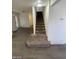 Stairs with carpet runner and neutral walls at 1590 Mustang Dr, Henderson, NV 89002