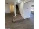 A carpeted staircase in the home's entryway at 1590 Mustang Dr, Henderson, NV 89002