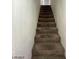 Carpeted staircase leading to the upper level at 1590 Mustang Dr, Henderson, NV 89002