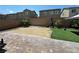 The backyard has artificial grass, gravel, and brick pavers at 181 Elexese Ct, Las Vegas, NV 89183
