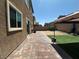 The backyard features brick pavers and artificial grass at 181 Elexese Ct, Las Vegas, NV 89183