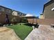 Well-maintained backyard with patio, artificial turf, and a gazebo, perfect for outdoor enjoyment at 181 Elexese Ct, Las Vegas, NV 89183