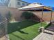 Backyard with gazebo, decorative rock and pet area with artificial turf at 181 Elexese Ct, Las Vegas, NV 89183
