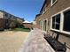 The backyard has artificial grass, gravel, and brick pavers at 181 Elexese Ct, Las Vegas, NV 89183