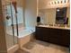 The bathroom features a soaking tub, a walk-in shower and a dual sink vanity at 181 Elexese Ct, Las Vegas, NV 89183