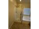 Bathroom featuring a tiled shower, soaking tub, and window at 181 Elexese Ct, Las Vegas, NV 89183