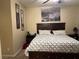 A serene bedroom featuring a large bed, art, and bedside tables at 181 Elexese Ct, Las Vegas, NV 89183
