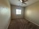Bedroom featuring carpeted floors, a ceiling fan, and a window at 181 Elexese Ct, Las Vegas, NV 89183