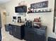 The coffee bar features a wine cooler, coffee maker, and upper storage for wine glasses at 181 Elexese Ct, Las Vegas, NV 89183