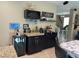The coffee bar area is equipped with a wine cooler and granite countertops at 181 Elexese Ct, Las Vegas, NV 89183