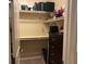A walk-in closet with empty shelves and a dark wood dresser at 181 Elexese Ct, Las Vegas, NV 89183