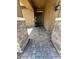 Inviting entrance with beautiful stone pillars and brick paved walkway at 181 Elexese Ct, Las Vegas, NV 89183