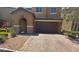 Charming two-story home with a two car garage and manicured landscaping at 181 Elexese Ct, Las Vegas, NV 89183