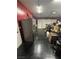 The garage has a refrigerator and sealed concrete floor at 181 Elexese Ct, Las Vegas, NV 89183