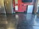 Garage with stainless refrigerator and Tesla power wall at 181 Elexese Ct, Las Vegas, NV 89183