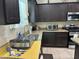 Modern kitchen features granite countertops, stainless steel appliances, and ample cabinet space at 181 Elexese Ct, Las Vegas, NV 89183