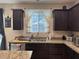 Modern kitchen features granite countertops, stainless steel appliances, and ample cabinet space at 181 Elexese Ct, Las Vegas, NV 89183