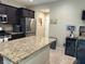 Modern kitchen features granite countertops, stainless steel appliances, and ample cabinet space at 181 Elexese Ct, Las Vegas, NV 89183