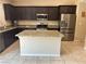 Spacious kitchen with granite counters, stainless appliances, and center island at 181 Elexese Ct, Las Vegas, NV 89183