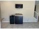 Kitchen with granite counters, dark cabinets, and a wine storage area at 181 Elexese Ct, Las Vegas, NV 89183