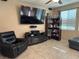 Comfortable living room featuring a ceiling fan, and a wall-mounted TV above entertainment center at 181 Elexese Ct, Las Vegas, NV 89183