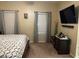 The main bedroom has two large windows providing natural light and soft carpeting at 181 Elexese Ct, Las Vegas, NV 89183