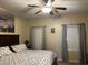 The spacious main bedroom features a ceiling fan, soft carpeting, and natural light at 181 Elexese Ct, Las Vegas, NV 89183