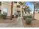 Residential building exterior with walkway and landscaping at 2251 Wigwam Pkwy # 211, Henderson, NV 89074