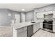 Modern kitchen with white cabinets and stainless steel appliances at 2251 Wigwam Pkwy # 211, Henderson, NV 89074