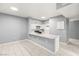 Modern kitchen with white cabinets, quartz countertops, and stainless steel appliances at 2251 Wigwam Pkwy # 211, Henderson, NV 89074