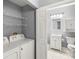 Laundry room with washer, dryer, and additional shelving at 2251 Wigwam Pkwy # 211, Henderson, NV 89074