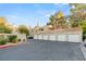 Exterior view of building with attached garages and landscaping at 2251 Wigwam Pkwy # 211, Henderson, NV 89074