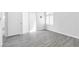 Simple bedroom with gray wood-look floors and white door at 2251 Wigwam Pkwy # 218, Henderson, NV 89074